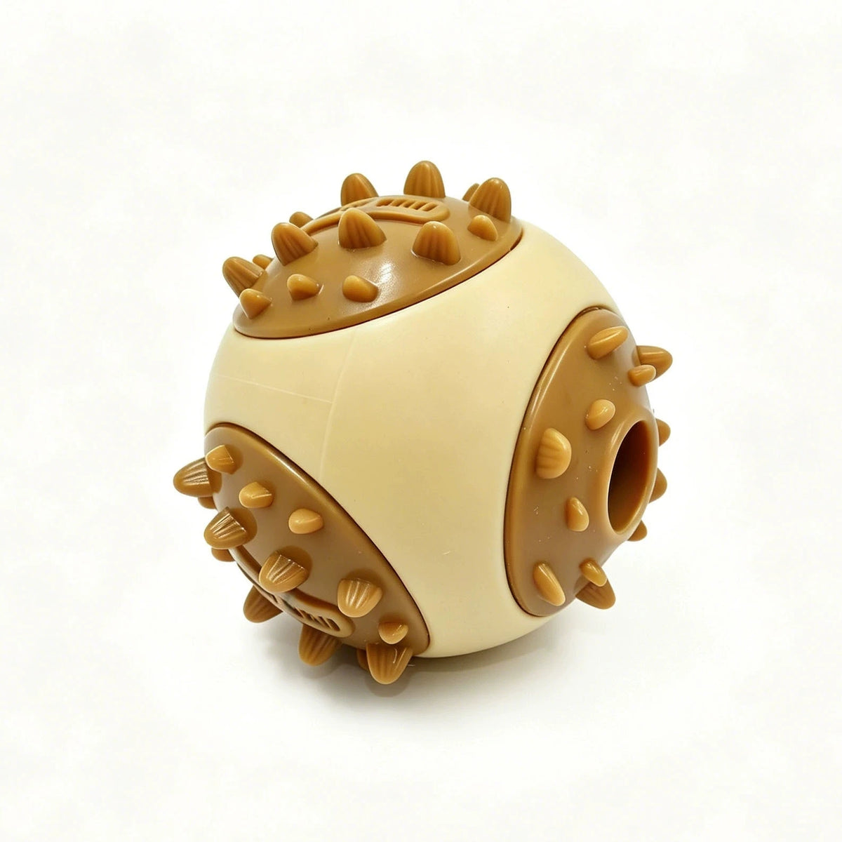 A round, beige and brown interactive bouncing fish treat dispenser for pets.
