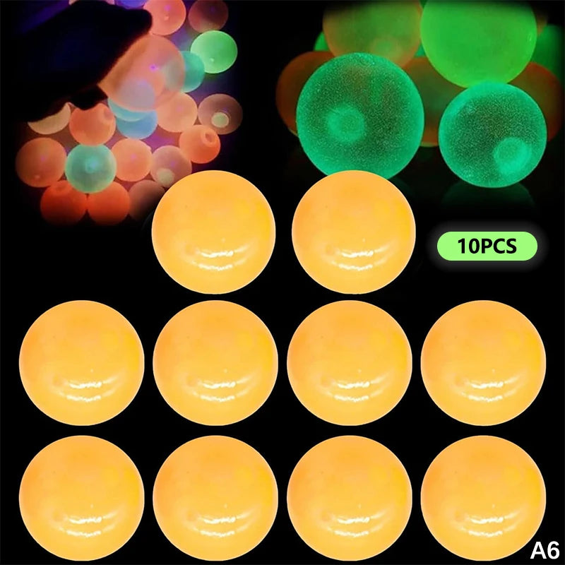 A set of ten glow-in-the-dark sticky sensory balls in yellow and green colors.
