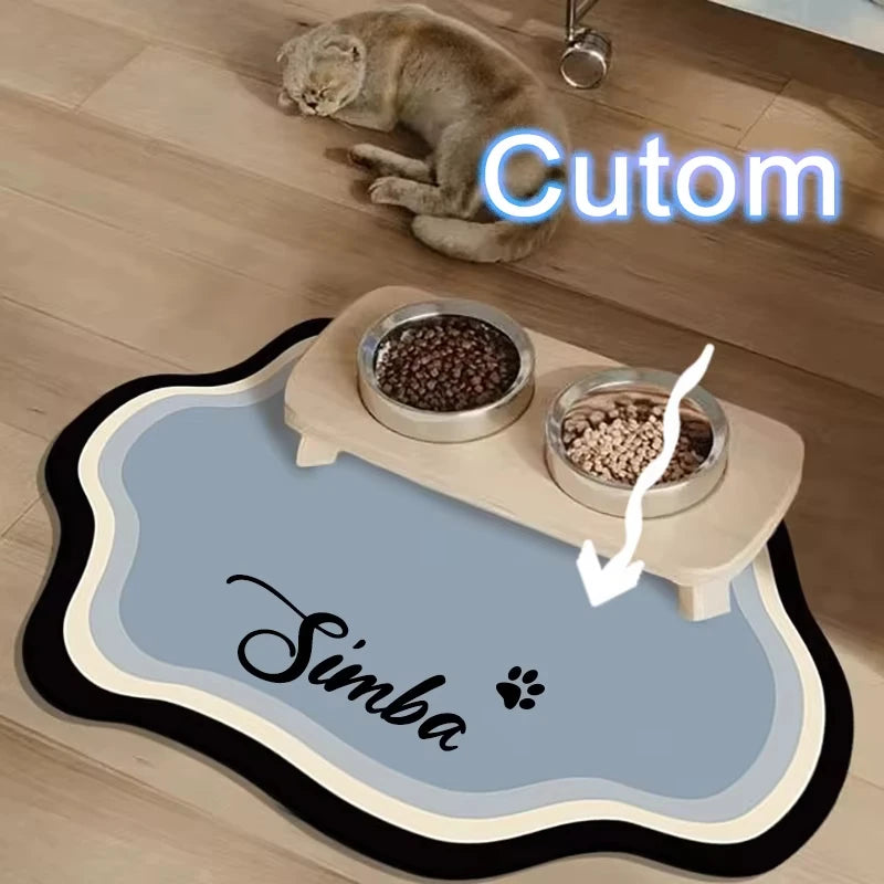 A light brown cat is resting on a feeding mat with seeds, labeled Cutom Simba.