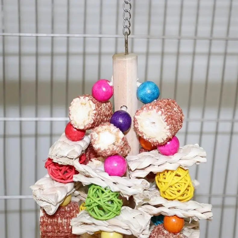 A colorful arrangement of natural wooden parrot bite toys, including various colored and textured pieces.