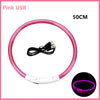 Pink USB rechargeable pet safety light collar with a flexible silicone band and a connector.