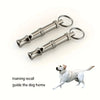 Adjustable stainless steel dog whistle with a metal loop for training recall.