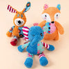 Three plush toys featuring fox, elephant, and puppy designs in orange, blue, and pink.