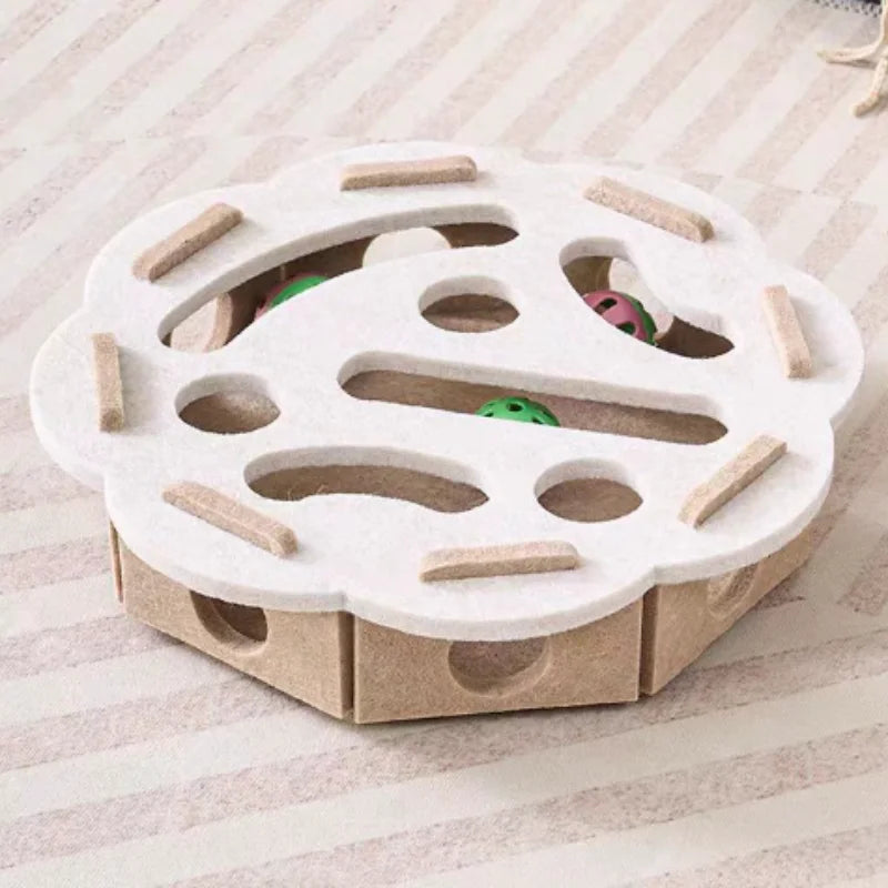 A white felt maze puzzle toy for cats with a bell ball, featuring various tunnels and obstacles.