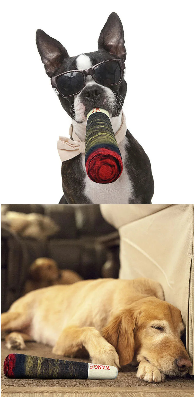 A dog is holding a cigar-shaped plush toy made of fabric and wood.