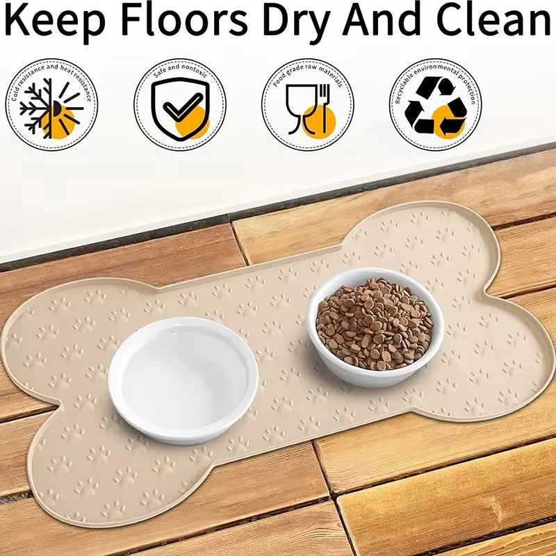 Anti-slip silicone pet feeding mat with a raised edge placed on a wooden surface.