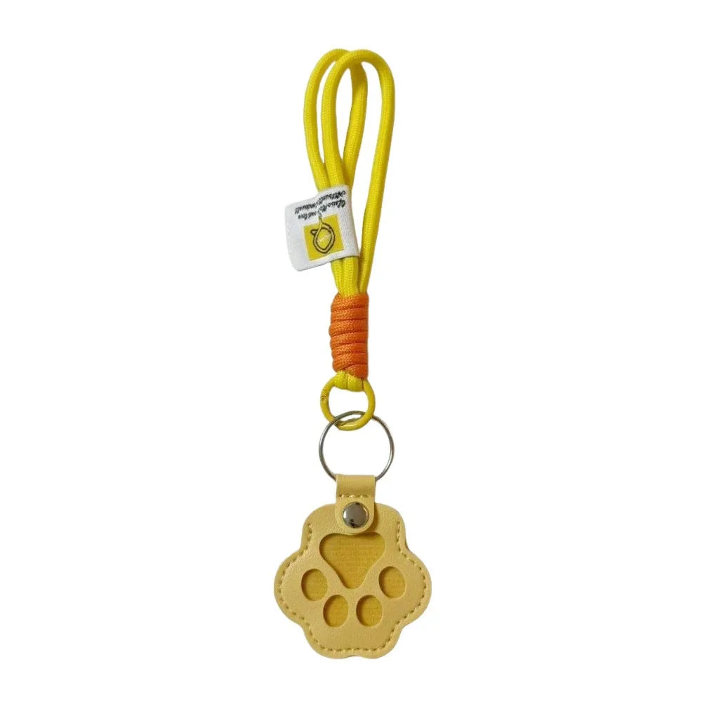 Yellow refillable pet hair keychain with a cat paw charm