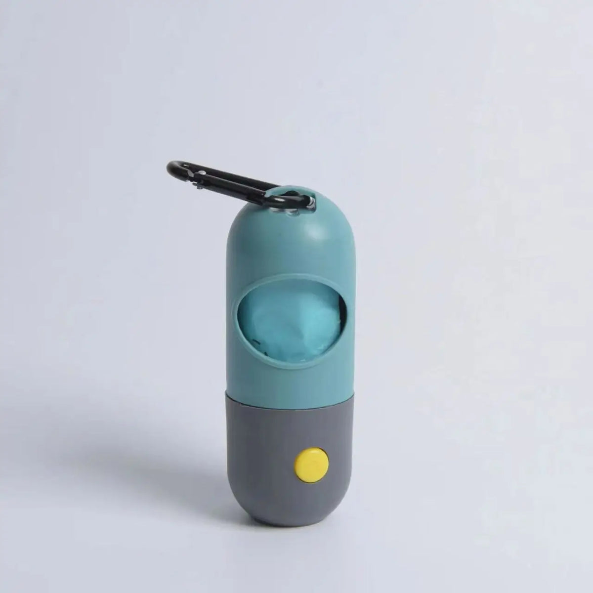A teal and gray capsule dog waste bag dispenser with a black flashlight attachment.