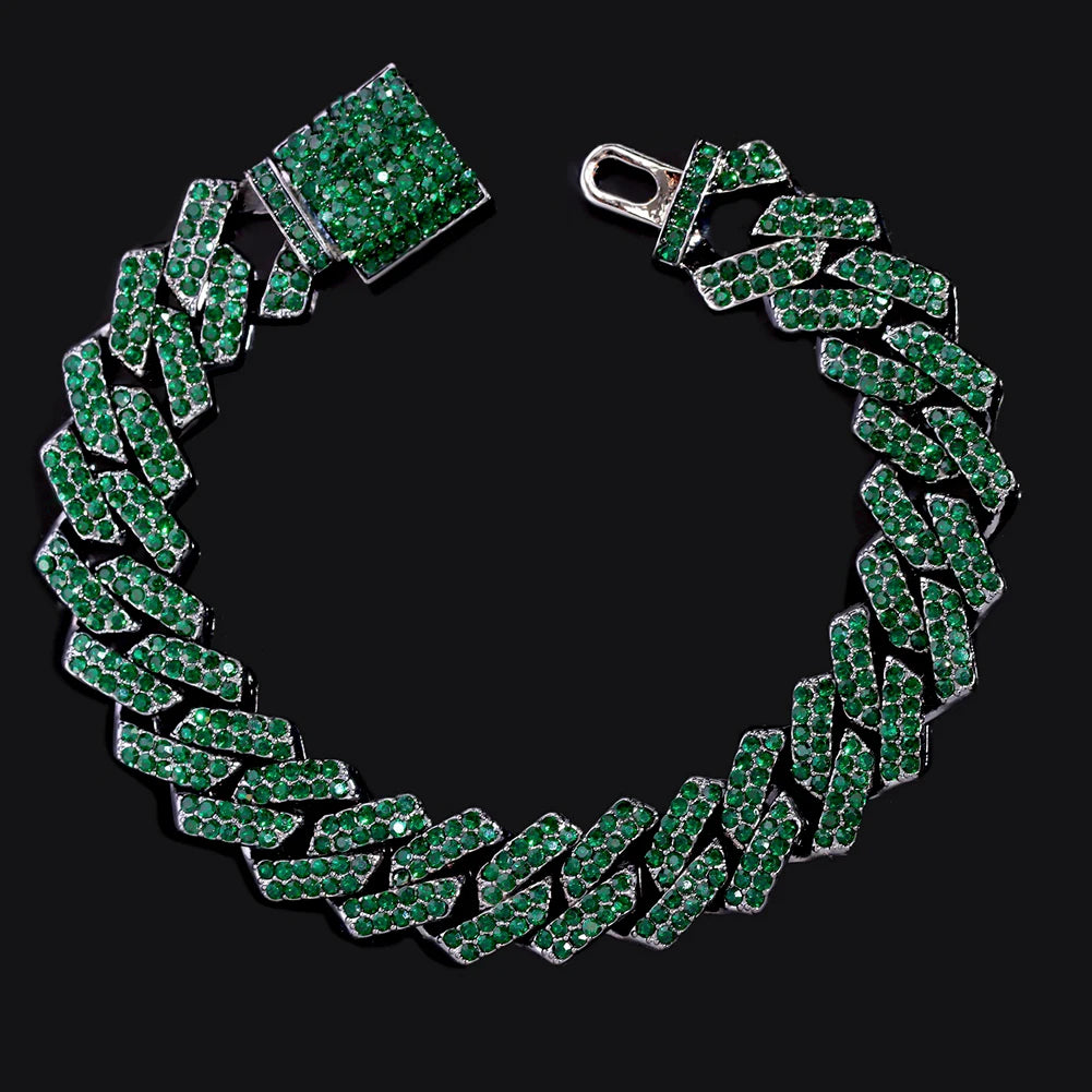 A green iced-out Cuban link bracelet with rhinestone pavé set against a black background.