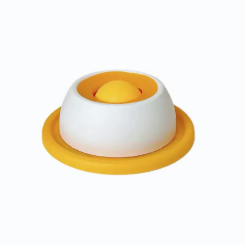 A round, yellow feeding mat with a central, raised yellow dome for dog or cat slow feeding.