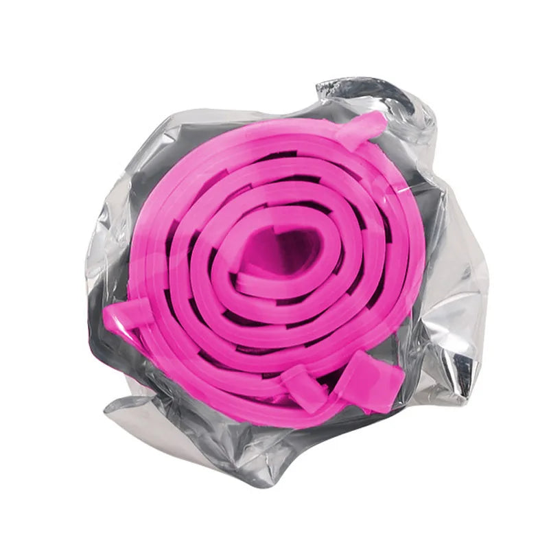 A roll of bright pink silicone pet collar for small dogs and cats, packaged in clear plastic.
