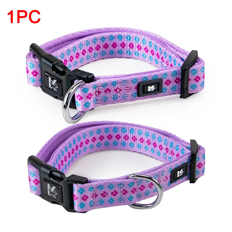 A purple plaid polyester dog collar with black hardware and a silver ring.