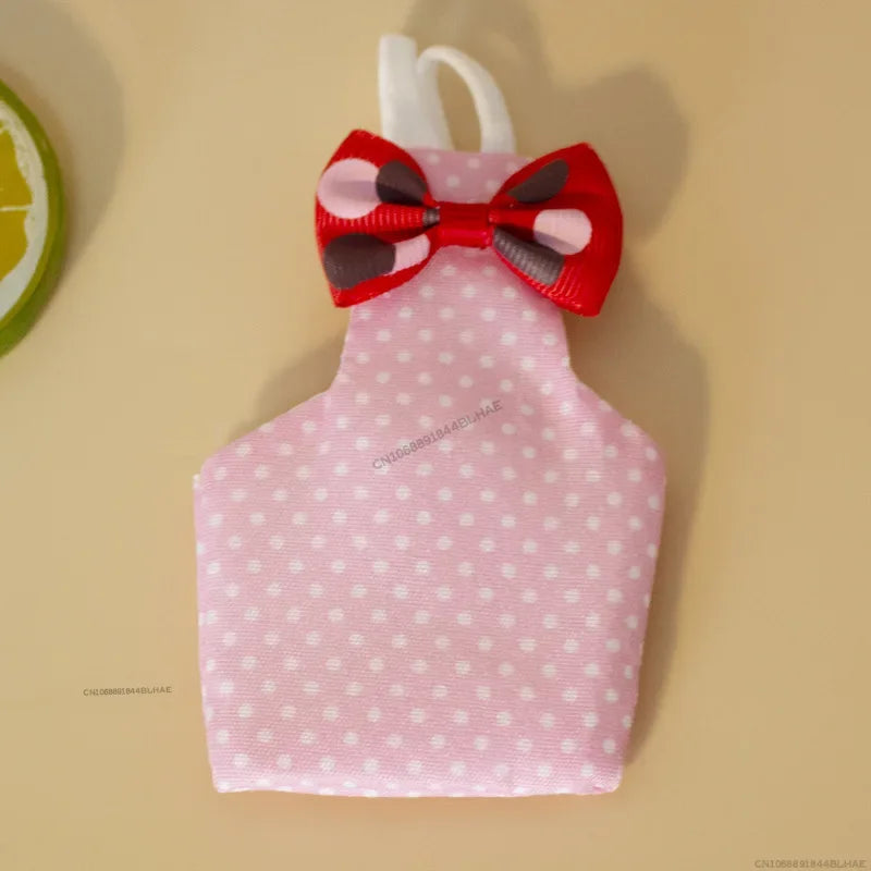 Pink parrot flight suit with a red and black bow tie