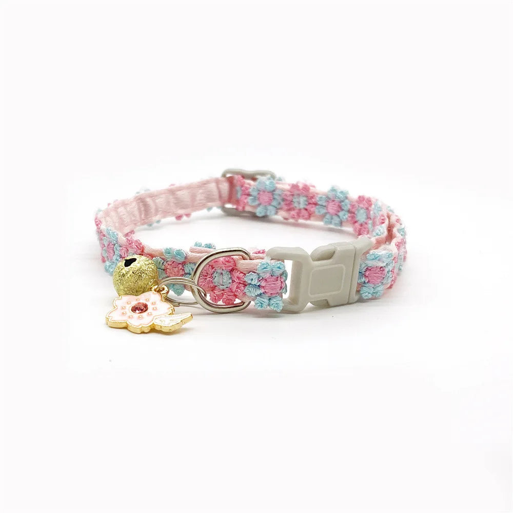Pink and blue lace flower cat collar with a gold bell and silver buckle