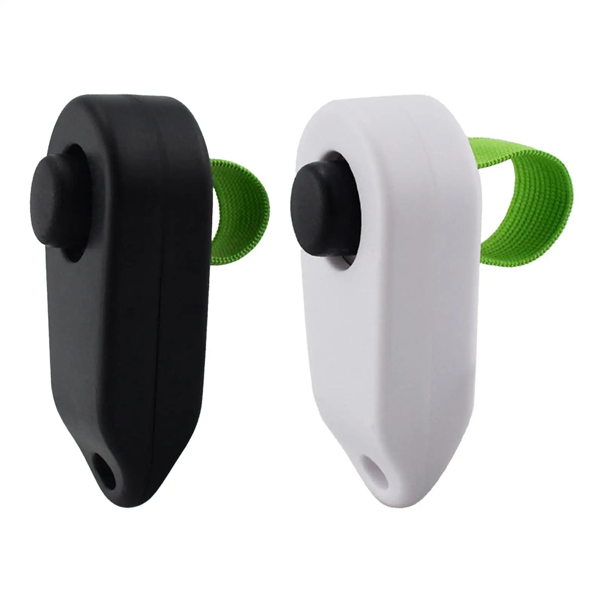 Un clicker pour chien portable noir et blanc avec une sangle verte pour l'entraînement à l'obéissance.