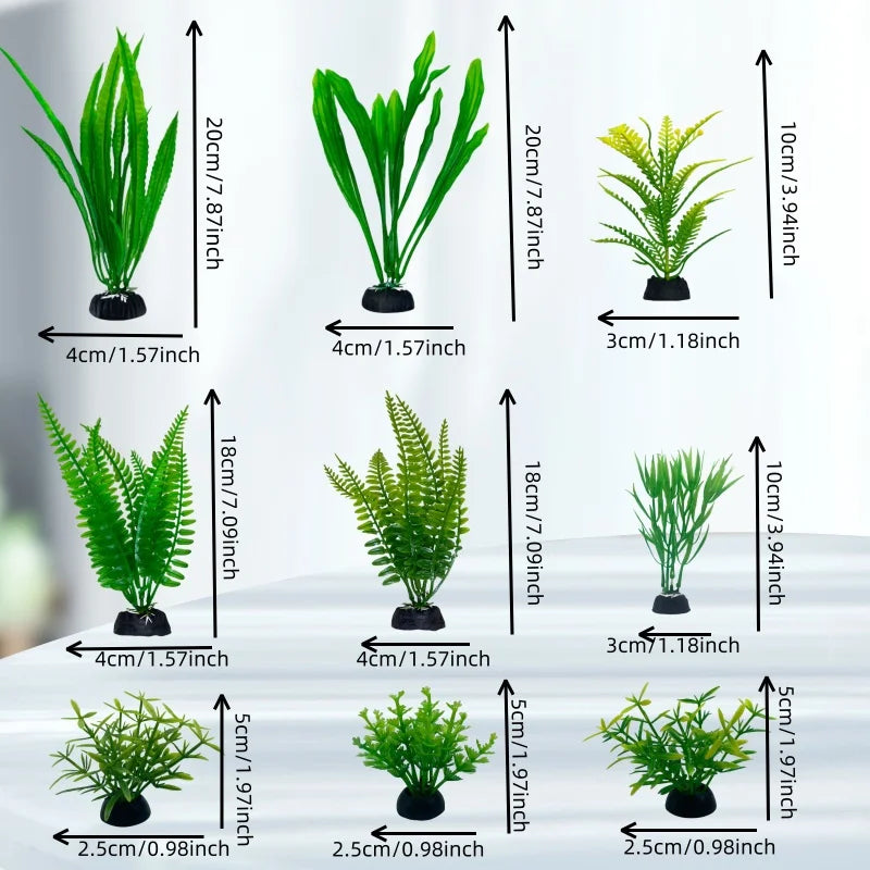 A set of 18 artificial aquarium plants in various sizes and shades displayed on a white surface.