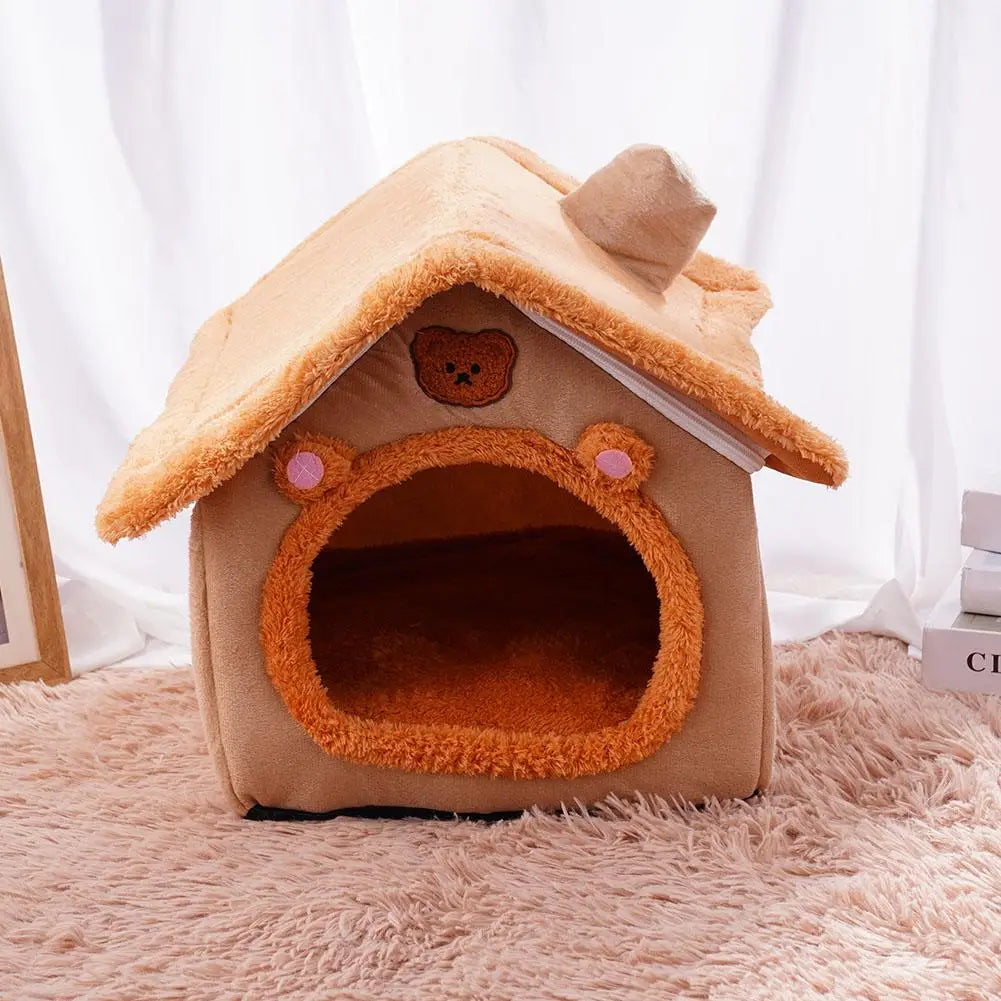 A cozy plush pet bed cave with a straw-colored roof and entrance for small dogs and cats.