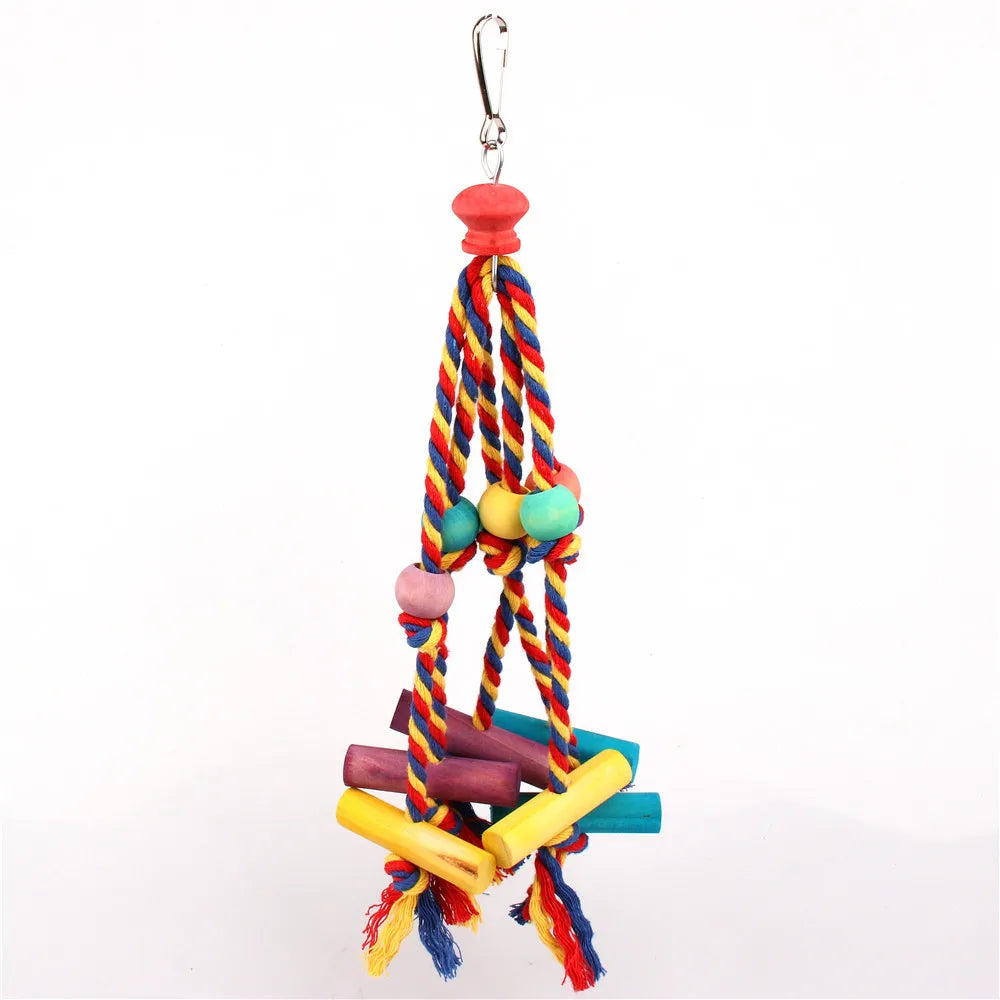 A colorful parrot chewing toy made of natural wood and cotton rope with wooden beads and a metal hook.