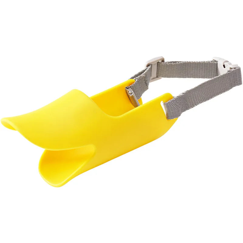 Yellow silicone duck-shaped dog muzzle with gray adjustable strap