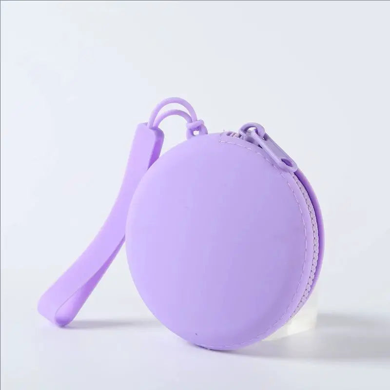 A purple silicone pet treat pouch with a loop for training and travel.