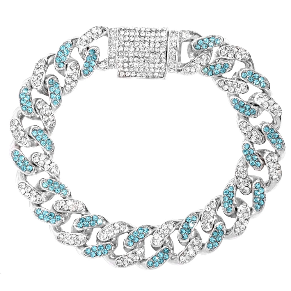 Silver iced-out Cuban link bracelet with blue stones and a rectangular centerpiece.
