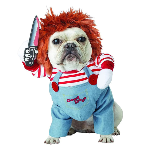 A bulldog wearing a red and white striped shirt, blue overalls, and a devil costume with a knife accessory.