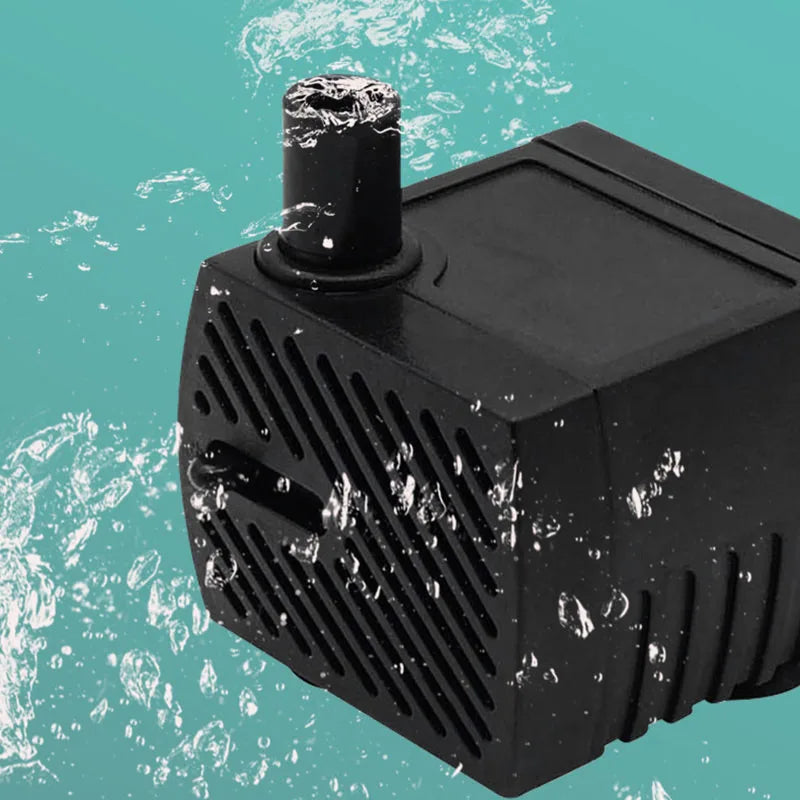 A black submersible aquarium water pump is shown against a teal background with splashing water.