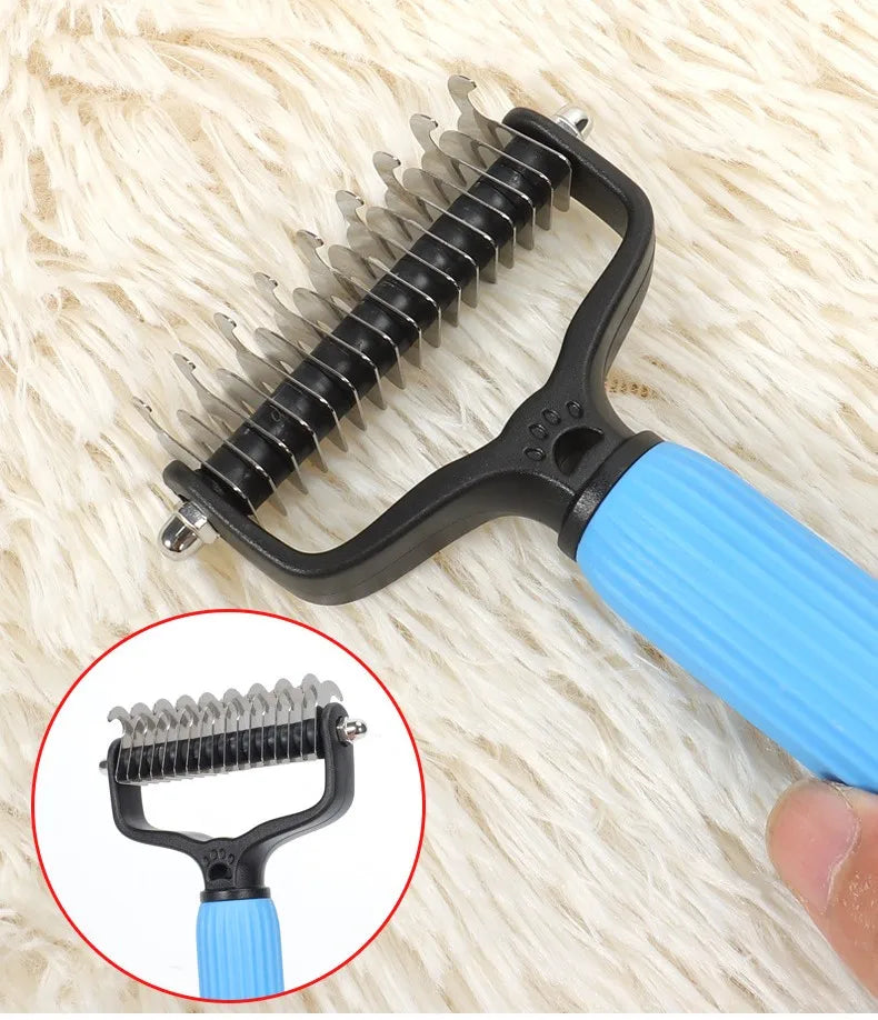 A black and blue double-sided stainless steel dematting comb for dogs resting on a white fluffy surface.