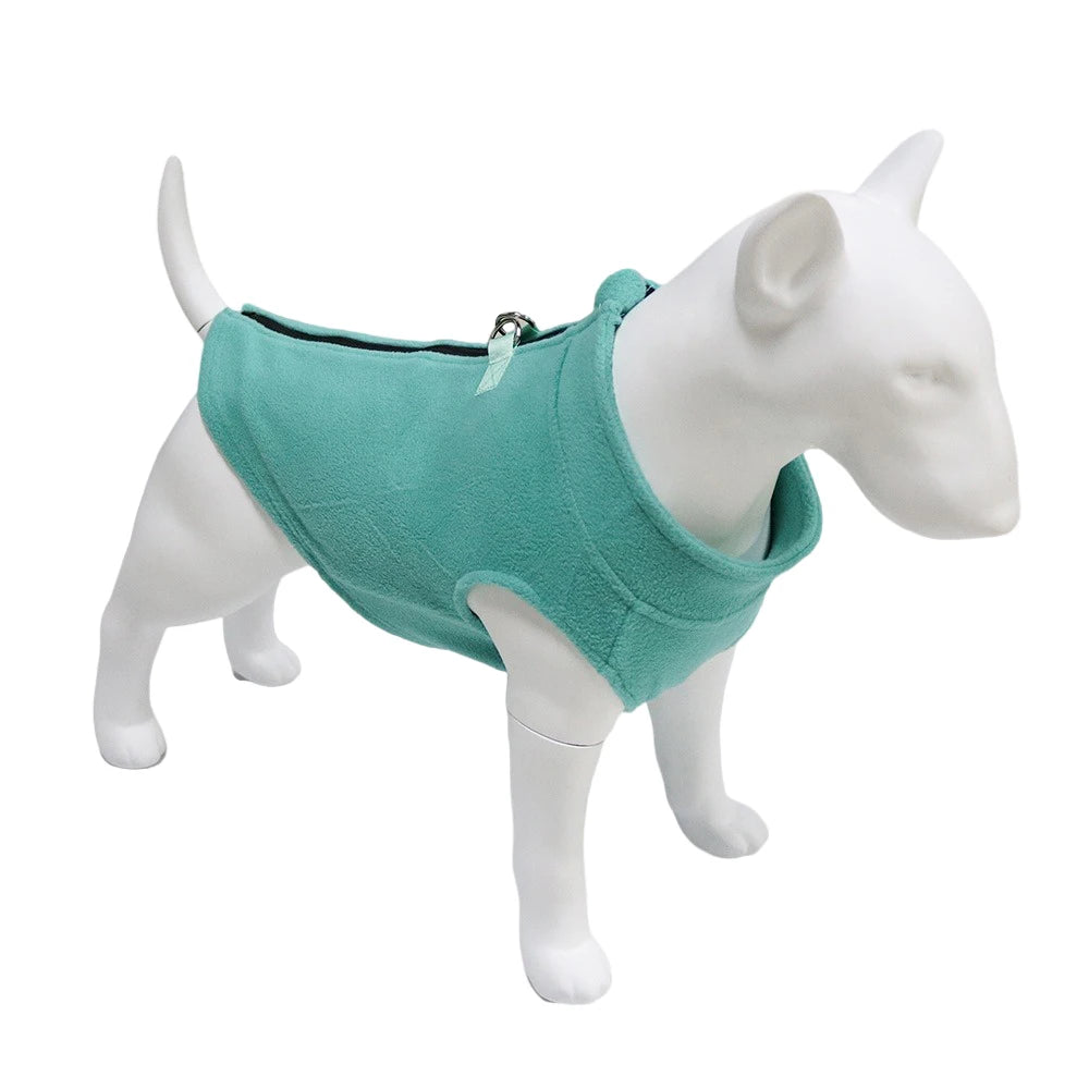A white dog model wearing a teal fleece vest with a zipper on its back.