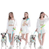 Three women demonstrate an adjustable hands-free dog leash for walking and exercise with dogs.