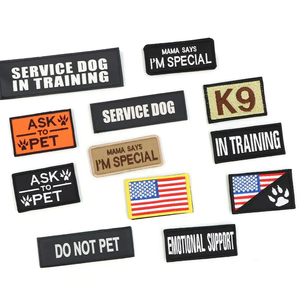 A set of black and tan tactical patches featuring phrases like Service Dog in Training, I'm Special, and K9 in Training.