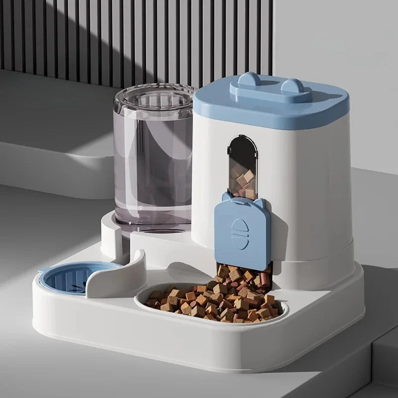 A white gravity pet food and water dispenser with a blue lid, holding kibble and water.