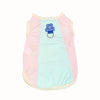 A pink and light blue cooling dog vest for summer with a blue charm.