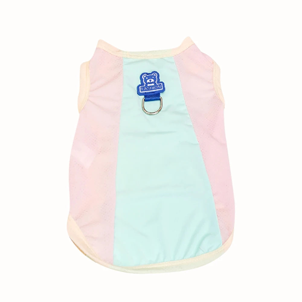 A pink and light blue cooling dog vest for summer with a blue charm.