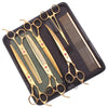 A black case holding a set of professional stainless steel pet grooming scissors and a comb.