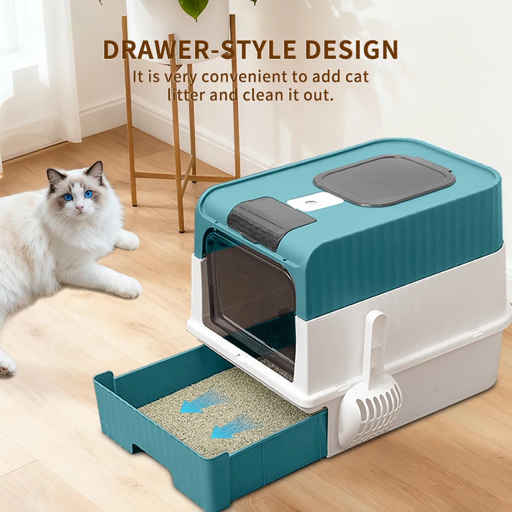 A teal and white drawer-style cat litter box with a removable tray and litter pan is shown on a wooden floor.