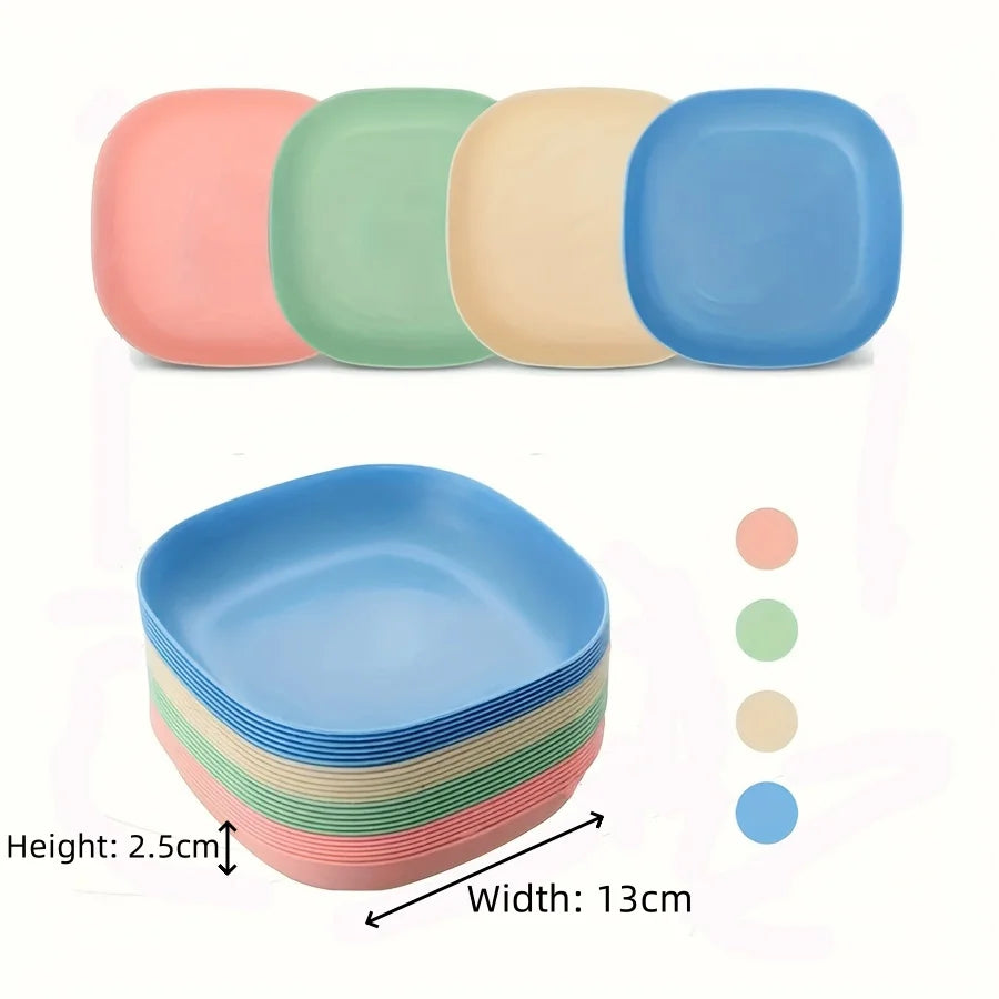 A set of non-slip shallow cat bowls in various pastel colors, including pink, green, beige, and blue.