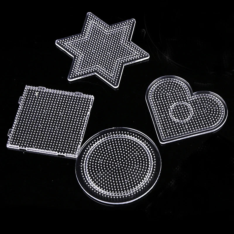 A set of precision hama beads including a star, heart, and circular shapes on a black background.