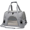 A gray foldable pet travel carrier bag with a breathable mesh window and shoulder straps.
