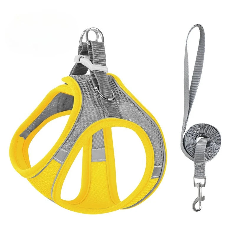 Yellow reflective no-pull dog harness with a leash attached