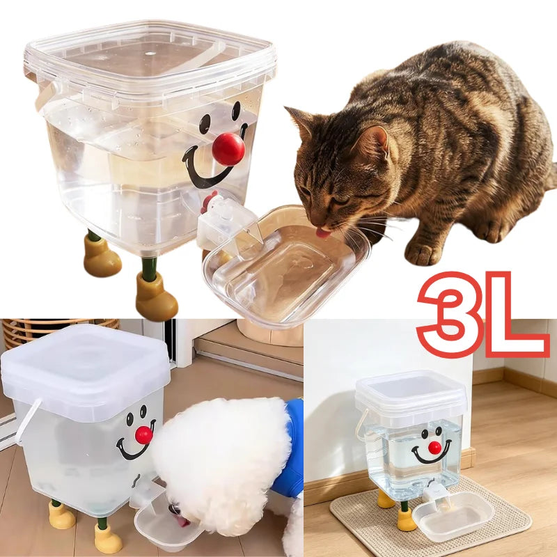 A clear automatic gravity pet water fountain with a cat face design and a white fluffy toy is shown.