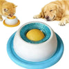 A yellow dog and a small orange cat are interacting with a blue slow feeder bowl designed for pet feeding.