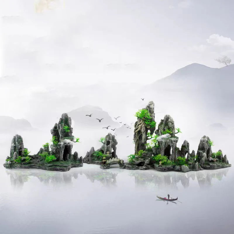 A resin aquarium rockery featuring mossy rocks, caves, and small green trees rising from calm water.