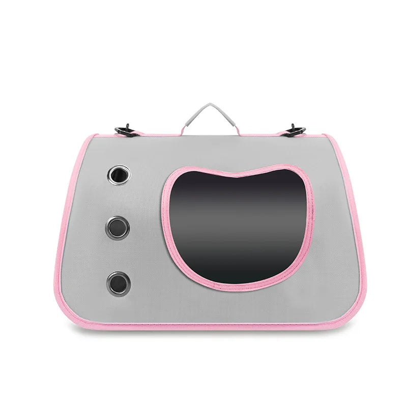 Graue faltbare Transportbox für Haustiere mit rosa Zierleisten und gekrümmter Öffnung für kleine Hunde oder Katzen.