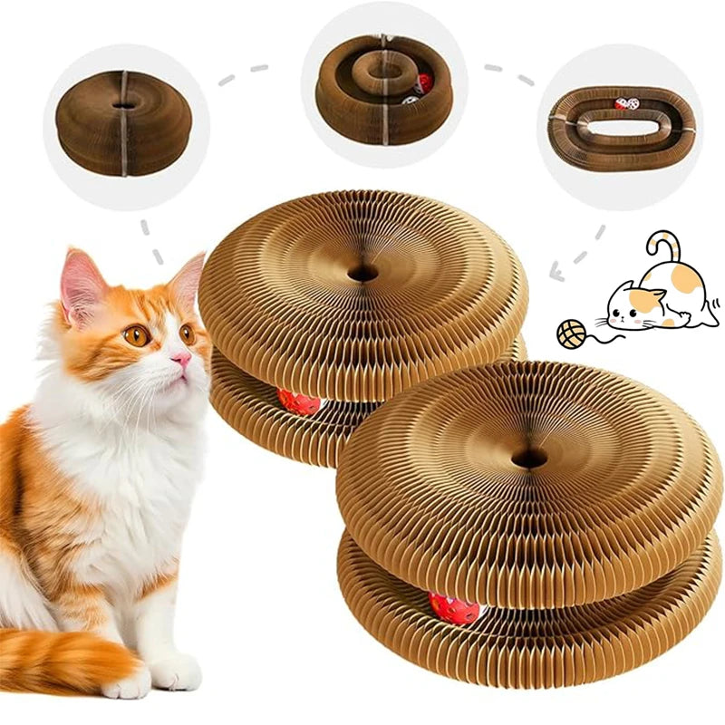 A fluffy orange and white cat sits next to a stack of brown, circular foldable cat scratcher boards with ball and bell tracks