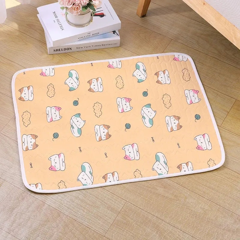 A rectangular pet cooling mat with a light peach background featuring small illustrations of cats and other animals.