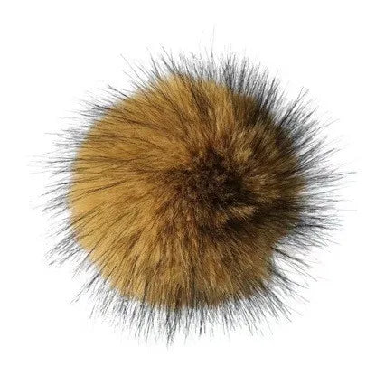 A spherical ball of brown and golden imitation rabbit fur used as a cat toy.