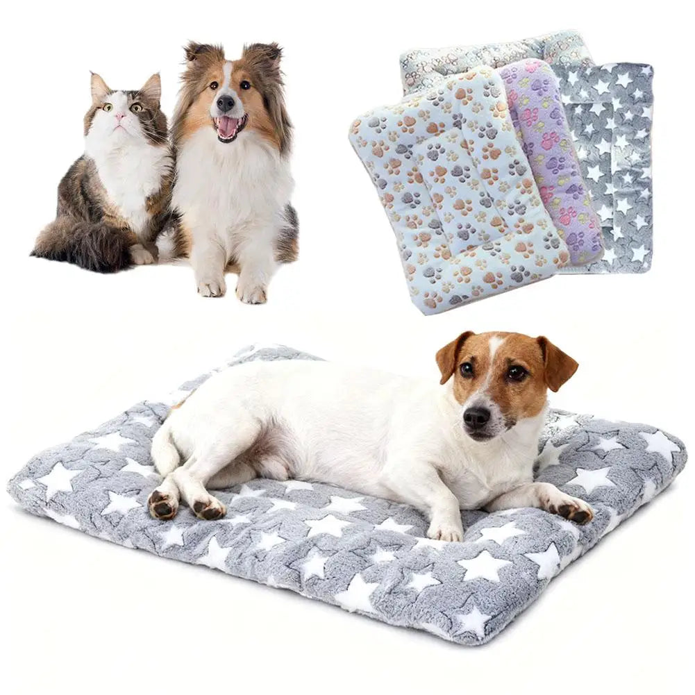 A collection of plush double-sided pet blankets and mats for cats and small dogs in various patterns.