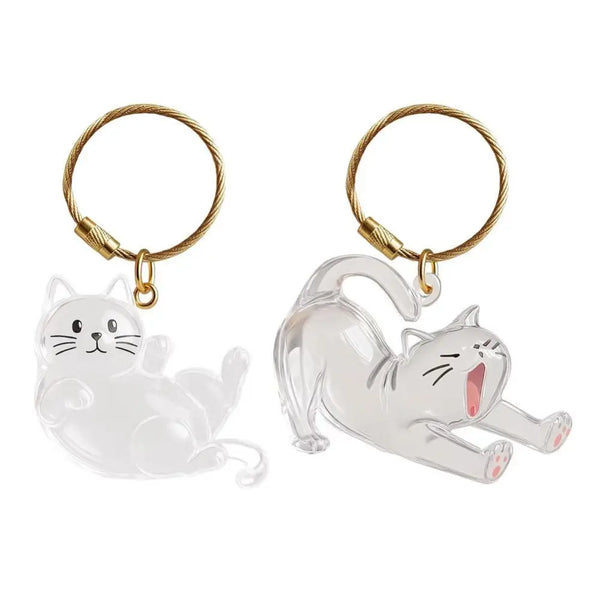 A clear silicone cat figurine keychain with a gold-colored loop and jump ring.