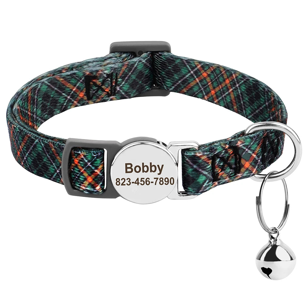 A plaid cat collar with a black strap and a silver engraved ID tag featuring the name Bobby and phone number.